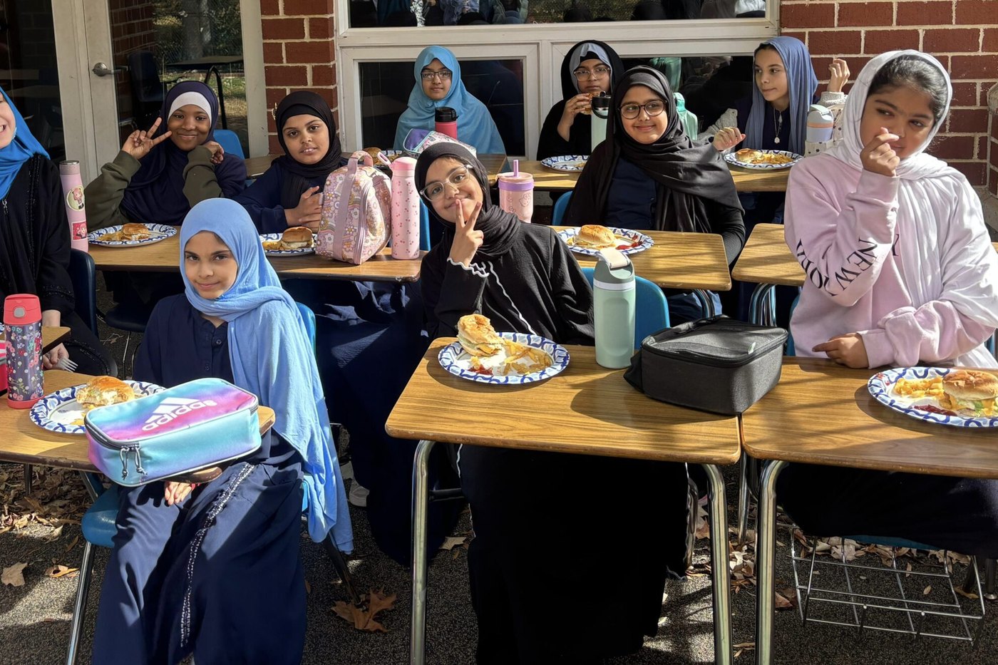 Oceans Academy students eating the lunch they brought from home