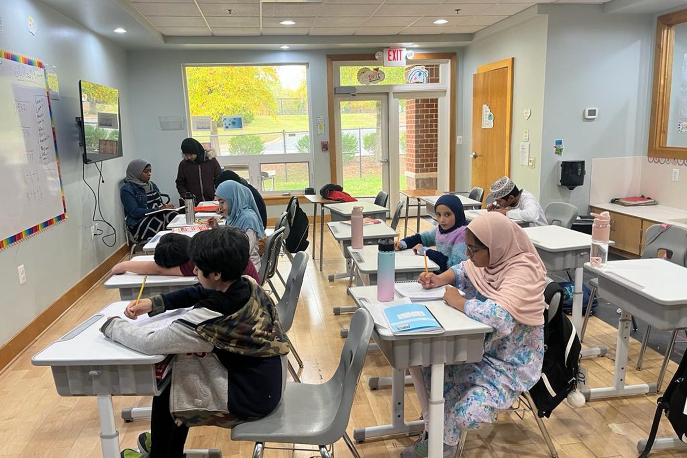 Oceans Academy students working on laptops in class