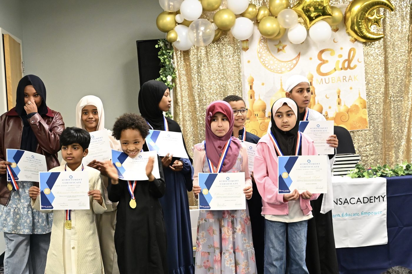 Oceans Academy elementary students receiving their certificates