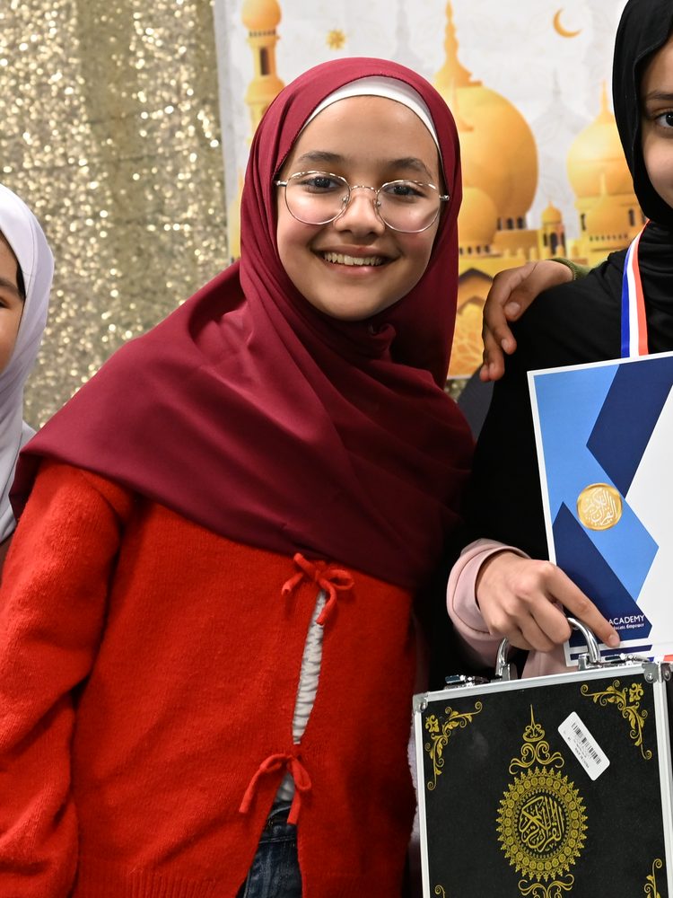 An Oceans Academy student smiling after the school's Qur'an competition