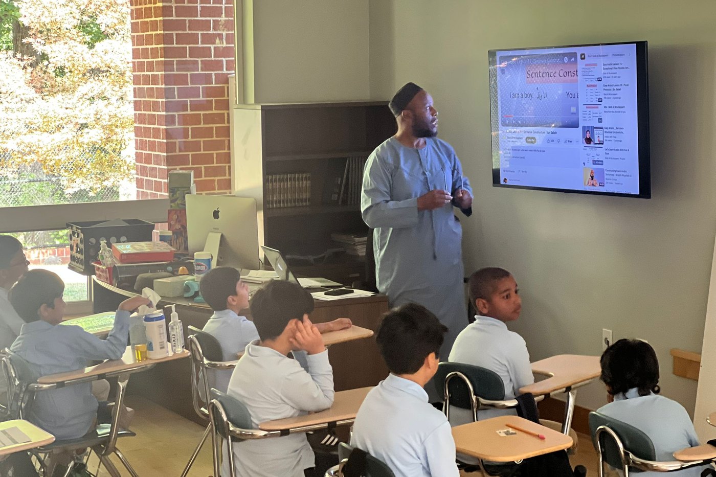 An Oceans Academy teacher leading a lesson on the classroom screen