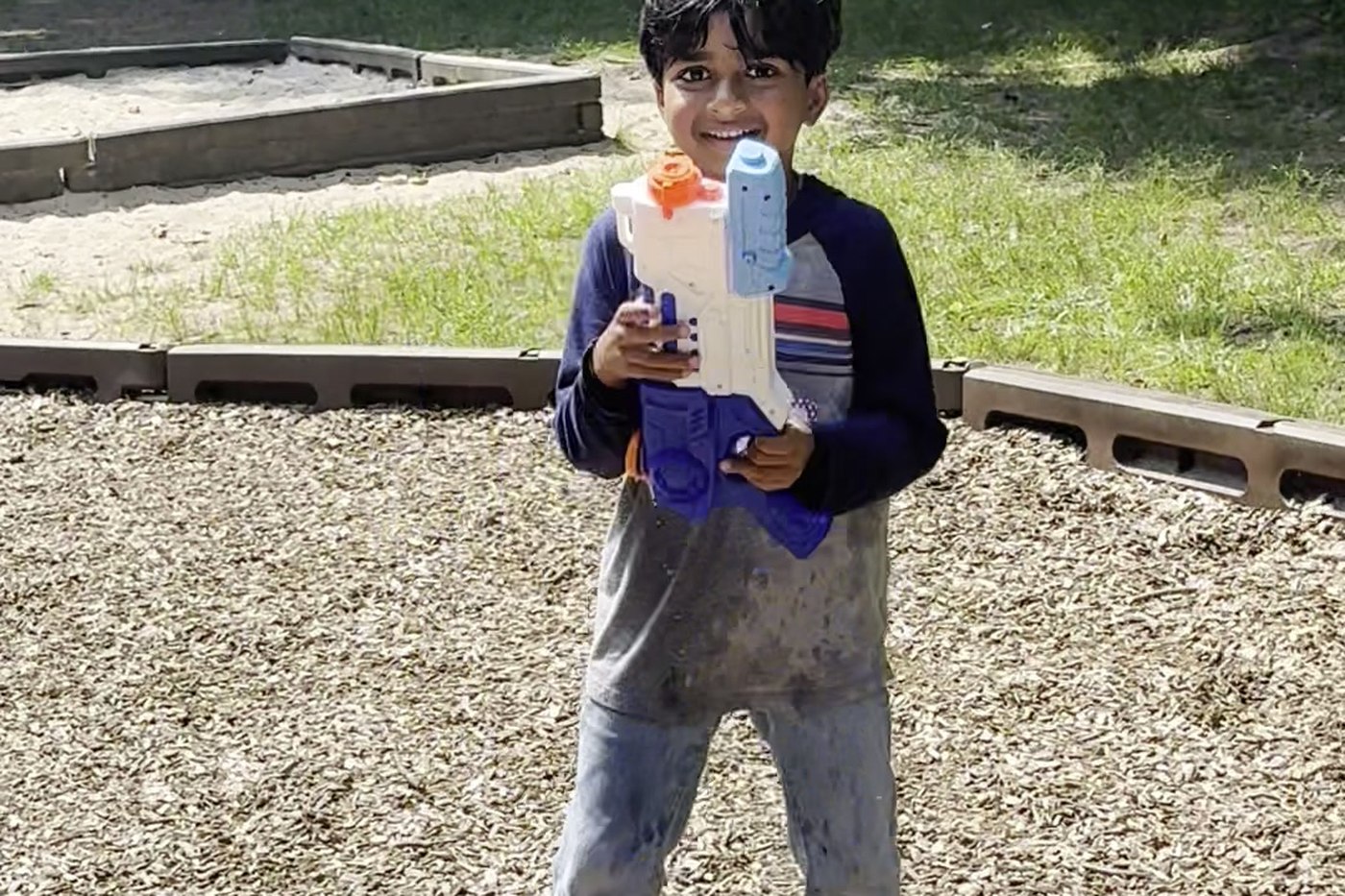 An Oceans Academy student playing outside on the playground during a school trip